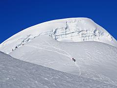 
As we neared Mera Peak Central Summit (6461m), I could see that all trekkers were turning back at the crevasse to the Central Summit. A few true mountaineers used fixed ropes to climb down into the crevasse and up the other side to reach the summit.
